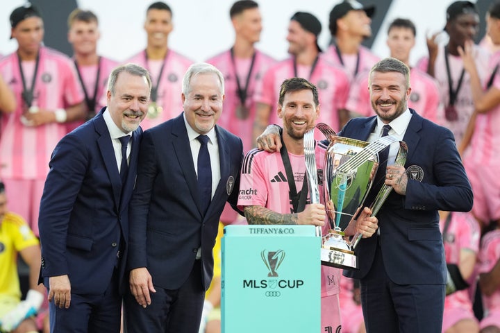 Inter Miami owners Jose Mas, left, his brother Jorge Mas and David Beckham pose with the MLS Cup trophy with forward Lionel Messi Saturday, Dec. 6, 2025, in Fort Lauderdale, Fla. (AP Photo/Rebecca Blackwell)
