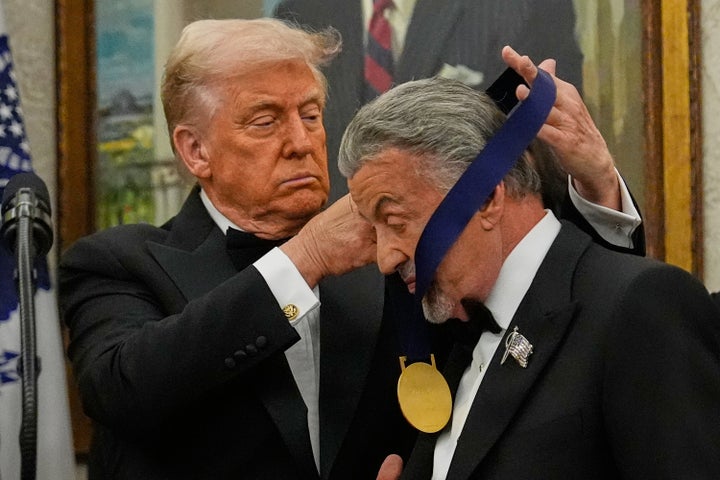 Trump Awards Medals To The Kennedy Heart Honorees In An Oval Workplace Ceremony 1 President Donald Trump, left, presents Sylvester Stallone with his Kennedy Center Honors medal in the Oval Office of the White House, Saturday, Dec. 6, 2025, in Washington. (AP Photo/Julia Demaree Nikhinson)