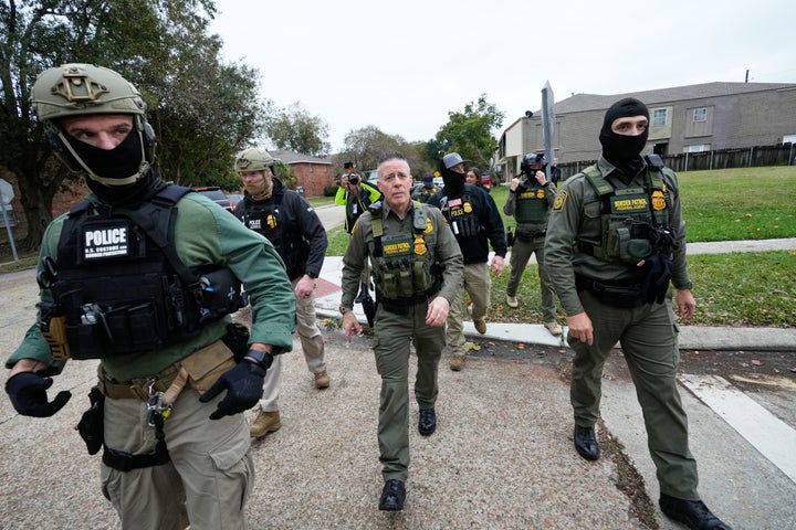 Customs and Border Patrol commander Gregory Bovino walks with border patrol agents through a neighborhood in Kenner, Louisiana during an immigration crackdown, on Dec. 5, 2025.