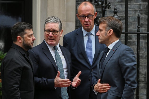 Ukrainian President Volodymyr Zelenskyy, left, with Britain's Prime Minister Keir Starmer, German Chancellor Friedrich Merz, and French President Emmanuel Macron, talk on the doorstep of 10 Downing Street, London, Monday, Dec. 8, 2025, following a meeting of the leaders inside. 