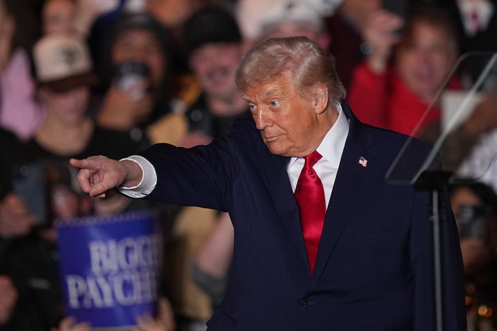 Triumph 1 President Donald Trump gestures to the crowd as he speaks at the Mount Airy Casino Resort in Mount Pocono, Pa., Tuesday, Dec. 9, 2025. (AP Photo/Matt Rourke)