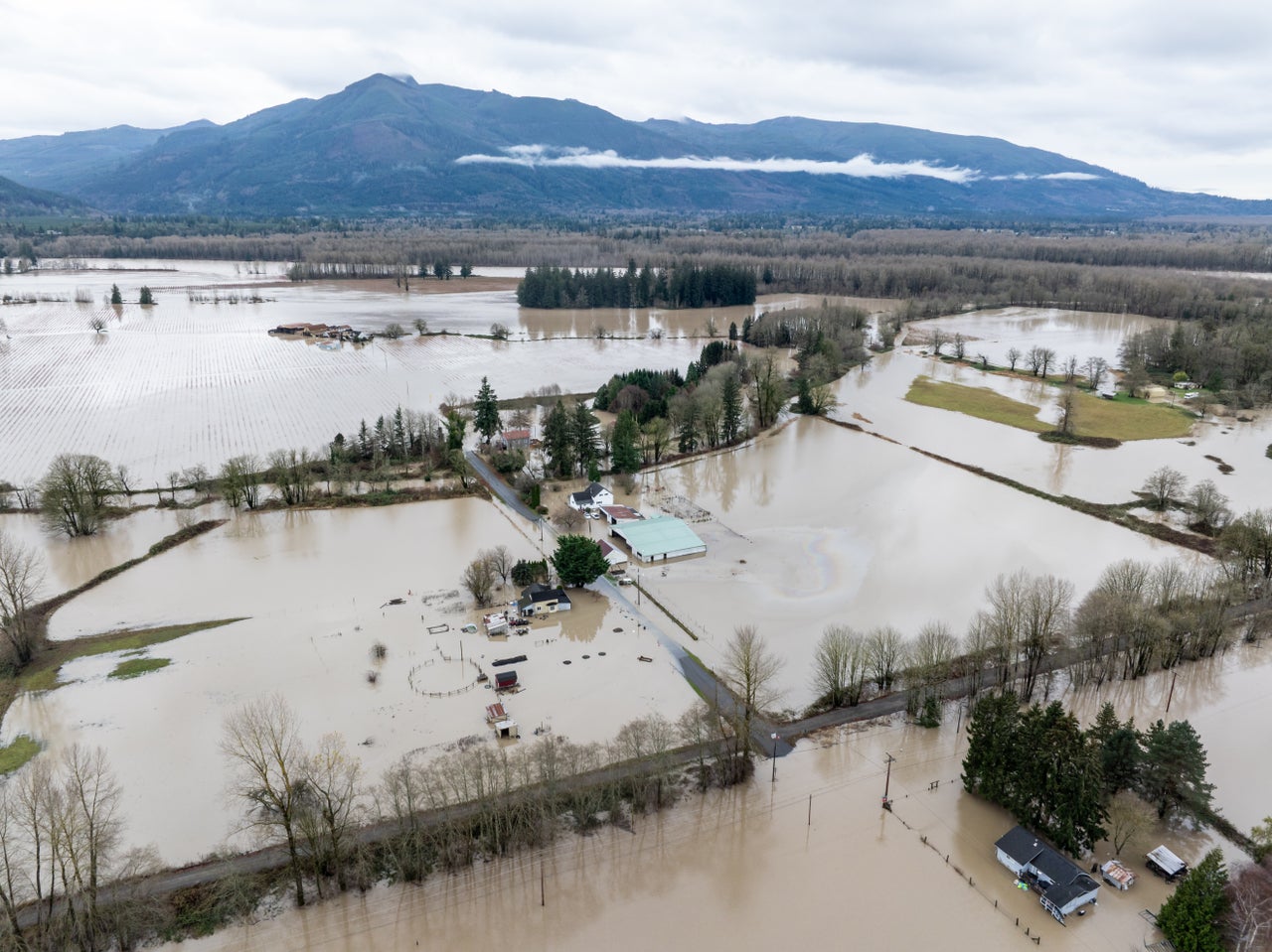 Surging Floodwaters In Washington State Strand People In Cars, Homes