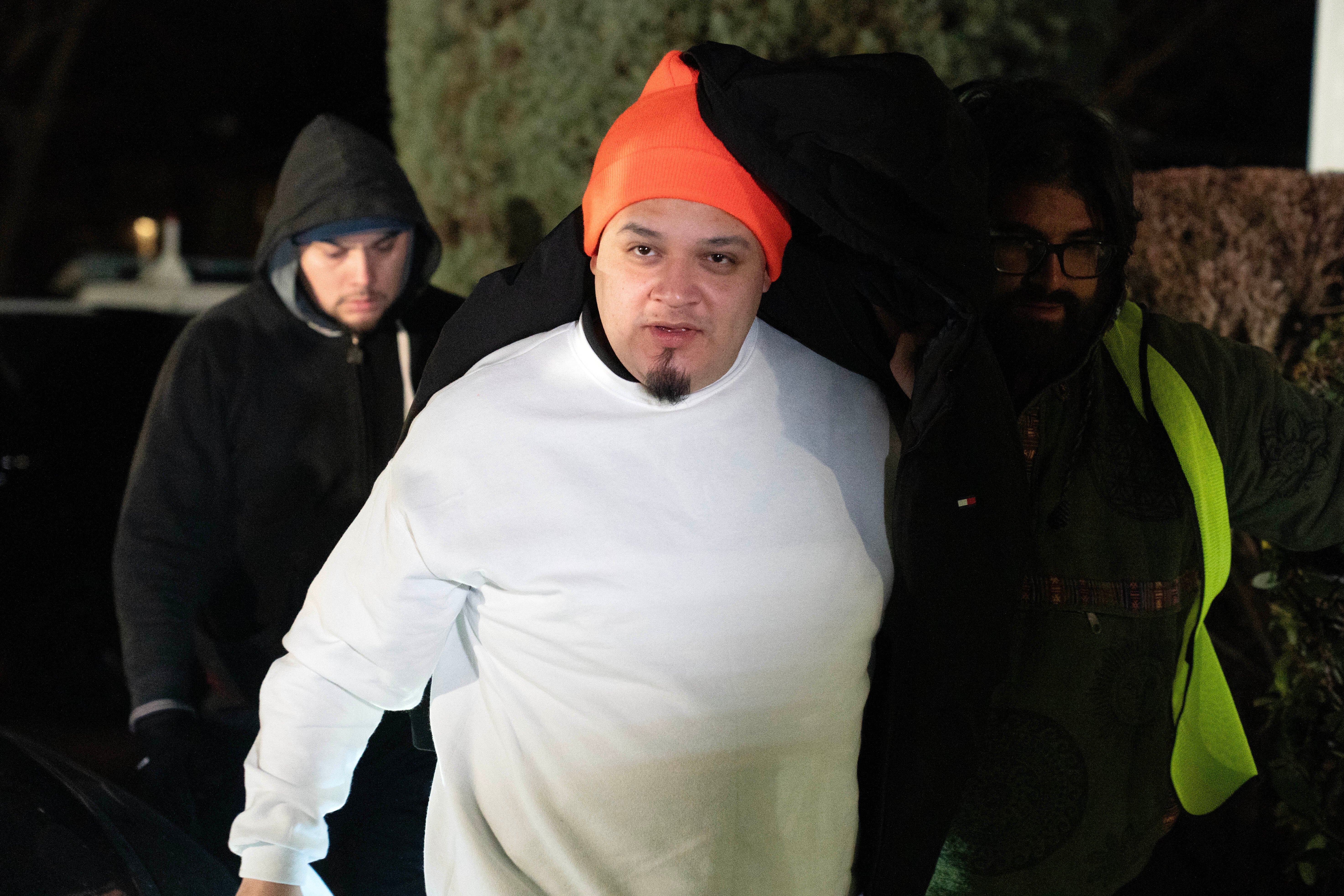 Kilmar Abrego GarcÃa arrives to his home in Beltsville, Md., Thursday, Dec. 11, 2025, after being released from ICE custody. (AP Photo/Jose Luis Magana)