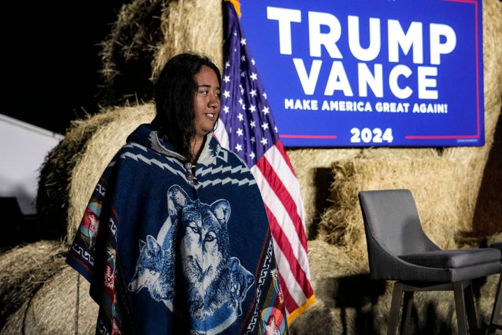 Abigail Blue, a member of the Lumbee Tribe, walks by the stage during a campaign event in support of then-presidential nominee Donald Trump, Oct. 18, 2024, in Red Springs, N.C.