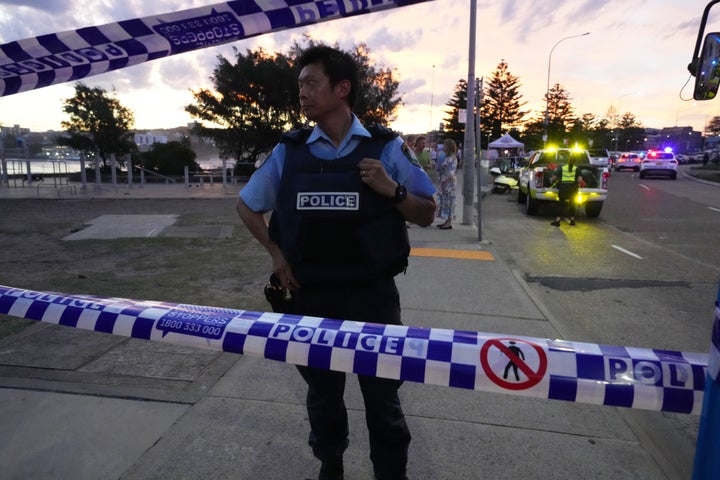 Father And Son Gunmen Kill At Least 15 People In Attack On Hanukkah Event At Sydney's Bondi Beach 3 Police cordon off an area at Bondi Beach after a reported shooting in Sydney, Sunday, Dec. 14, 2025. (AP Photo/Mark Baker)