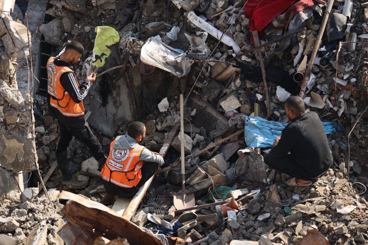 Medical teams and local residents in the Nasr neighborhood of Gaza continue search-and-rescue efforts to locate other members of the el-Halo family after their building collapsed from heavy rainfall and killed at least one family member, on Dec. 16, 2025.
