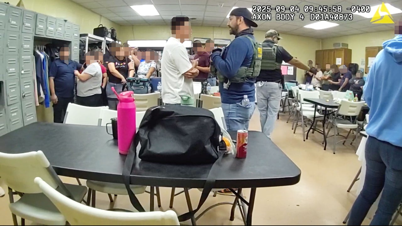 Federal agents question workers at Nutrition Bar Confectioners in Cato, New York on Sept. 4, 2025.