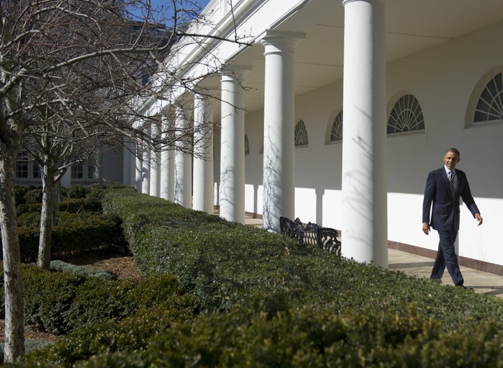 j 1 Former President Barack Obama walks along the West Wing colonnade in 2013.