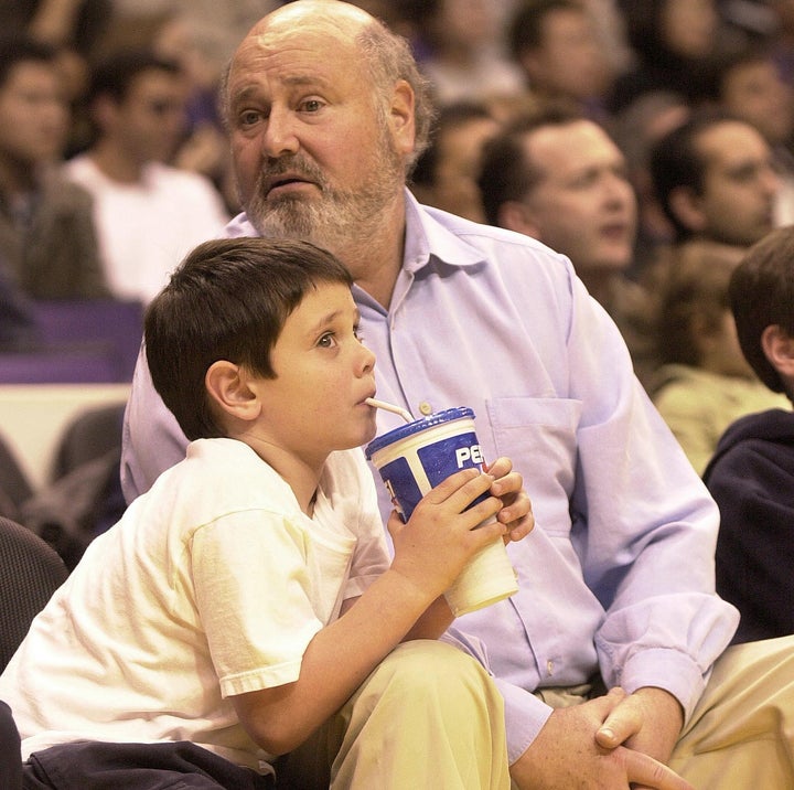 Rob Reiner and his son Nick Reiner watch a game between the San Antonio Spurs and the Los Angeles Lakers in March 2001. Reiner told the New Yorker in 2016 that he had a mantra as Nick was growing up: “Keep him alive until he’s 25.”