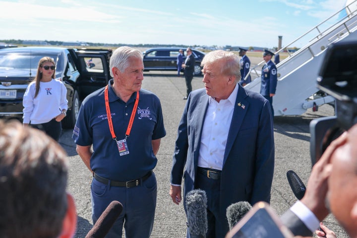 U.S. President Donald Trump stands with Bruce Blakeman, County Executive of Nassau County, New York, as he speaks with the media after arriving at the Republic Airport on Air Force One on September 26, 2025 in Farmingdale, New York. (Photo by Anna Moneymaker/Getty Images)