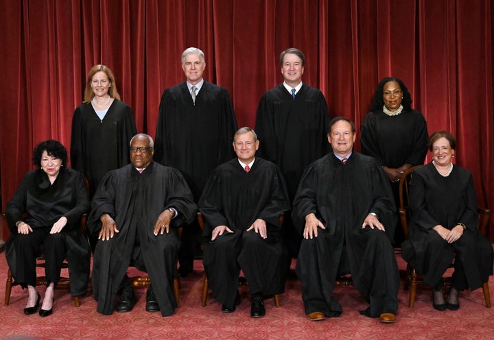 Justices of the US Supreme Court pose for their official photo at the Supreme Court in Washington, DC on October 7, 2022. (Photo by OLIVIER DOULIERY/AFP via Getty Images)