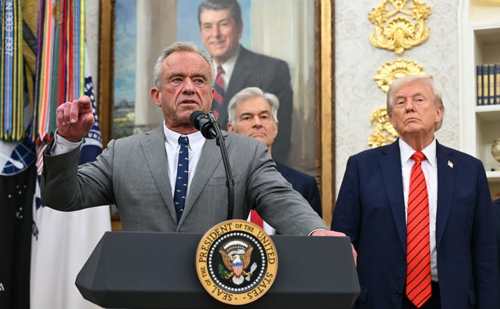 President Donald Trump listens as Health Secretary Robert F. Kennedy Jr. speaks Oct. 10 during an announcement at the White House.
