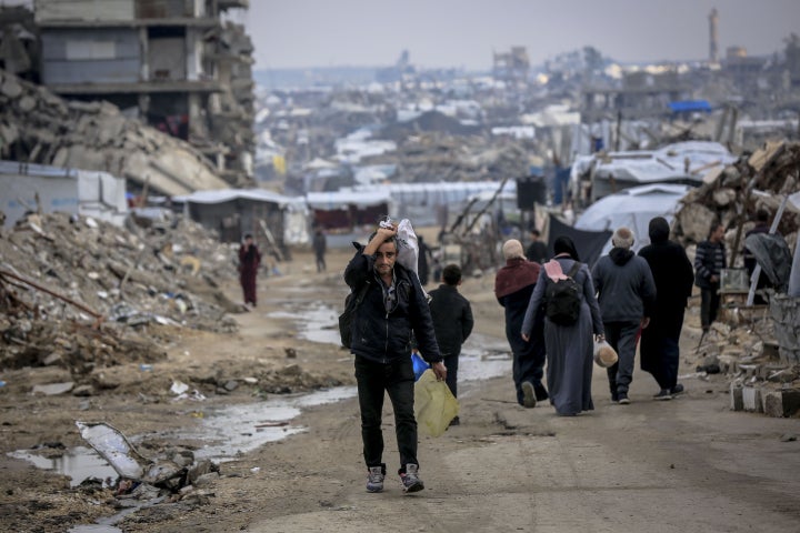 Palestinians living in makeshift tents try to continue their daily lives under difficult conditions amid the rubble left behind by Israeli attacks in Gaza City, Gaza on December 19, 2025. (Photo by Saeed M. M. T. Jaras/Anadolu via Getty Images)