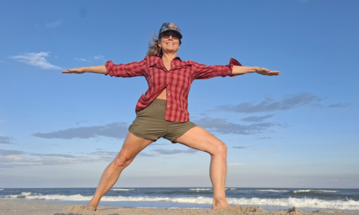 The author in warrior II pose (virabhadrasana II) in 2025.