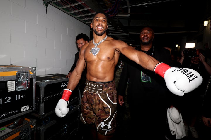 Anthony Joshua celebrates his victory over Jake Paul in their heavyweight bout at Kaseya Center on Dec. 19, 2025, in Miami.