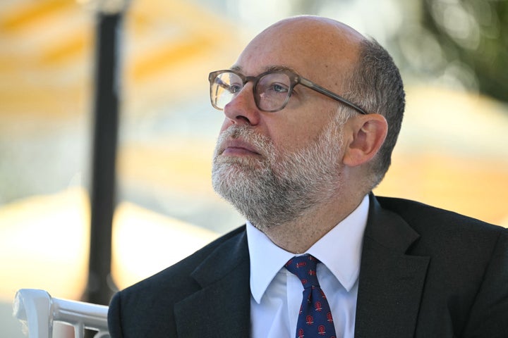 Director of the Office of Management and Budget (OMB) Russell Vought listens as President Donald Trump speaks at a Rose Garden Club lunch at the White House on October 21, 2025.