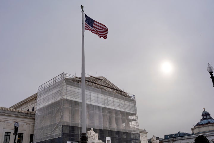 With the Supreme Court Building under renovations, the justices hear oral arguments on President Donald Trump's push to expand control over independent federal agencies, on Capitol Hill in Washington, Monday, Dec. 8, 2025. (AP Photo/J. Scott Applewhite)
