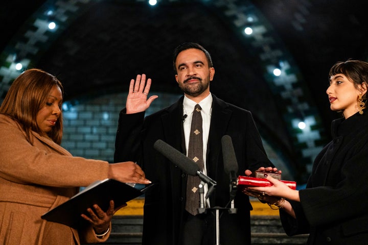 New York Attorney General Letitia James, left, administers the oath of office to mayor-elect Zohran Mamdani, center, as his wife Rama Duwaji looks on, Thursday, Jan. 1, 2026, in New York. (Amir Hamja/The New York Times via AP, Pool)