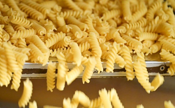 Fusilli pasta sits on the production line of the Barilla factory during the Barilla Innovation & Technology Experience (BITE) media day at the Barilla headquarters in Parma, on November 18, 2025. (Photo by STEFANO RELLANDINI/AFP via Getty Images)