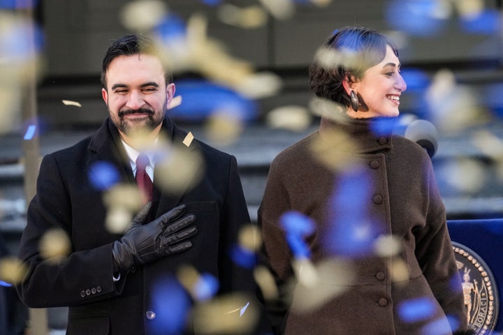 NEW YORK, NEW YORK - JANUARY 01: New York Mayor Zohran Mamdani and his wife Rama Duwaji smile as confetti falls after his ceremonial inauguration as mayor at City Hall Thursday January 1, 2026 in New York, NY. Mamdani has added a “block party” to the official inauguration events to allow thousands of New Yorkers to take part. Mamdani was officially sworn in at midnight by New York Attorney General Letitia James at the Old City Hall subway station in a private ceremony. (Photo by David Dee Delgado/Getty Images)
