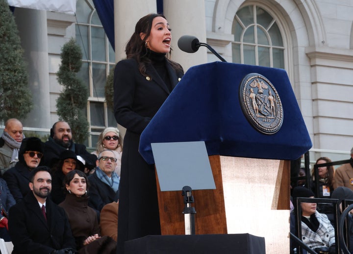 New York mayor Zohran Mamdani (L) and his wife Rama Duwaji listen to US Representative Alexandria Ocasio Cortez, Democrat of New York, speak during his public inauguration ceremony followed by a block party at City Hall in New York on January 1, 2026. Mamdani, the young upstart of the US left, was sworn in Thursday to take over as New York mayor for a term sure to see him cross swords with President Donald Trump. After the clocks struck midnight, bringing in 2026, Mamdani took his oath of office at an abandoned subway stop to begin managing the United States' largest city. He is New York's first Muslim mayor. (Photo by TIMOTHY A.CLARY / AFP via Getty Images)