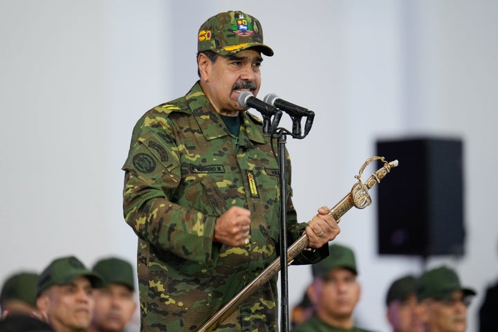Venezuelan President Nicolas Maduro speaks during a government-organized civic-military rally in Caracas, Venezuela, Tuesday, Nov. 25, 2025. (AP Photo/Ariana Cubillos)