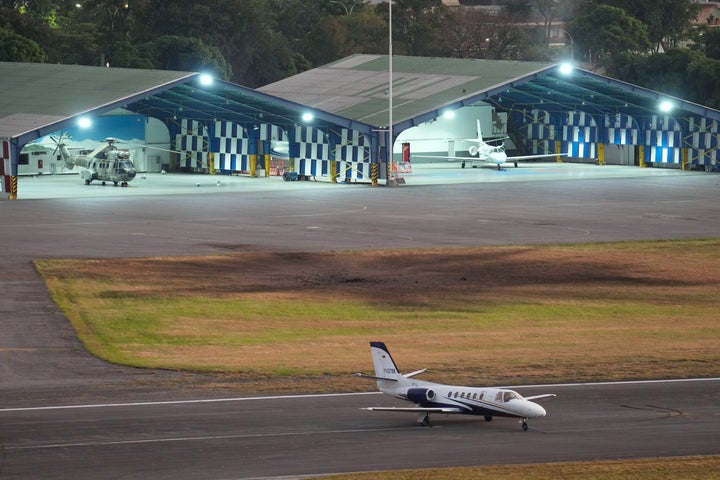 A scorched area is seen at La Carlota airport after explosions and low-flying aircraft were heard in Caracas, Venezuela, Saturday, Jan. 3, 2026. (AP Photo/Matias Delacroix)