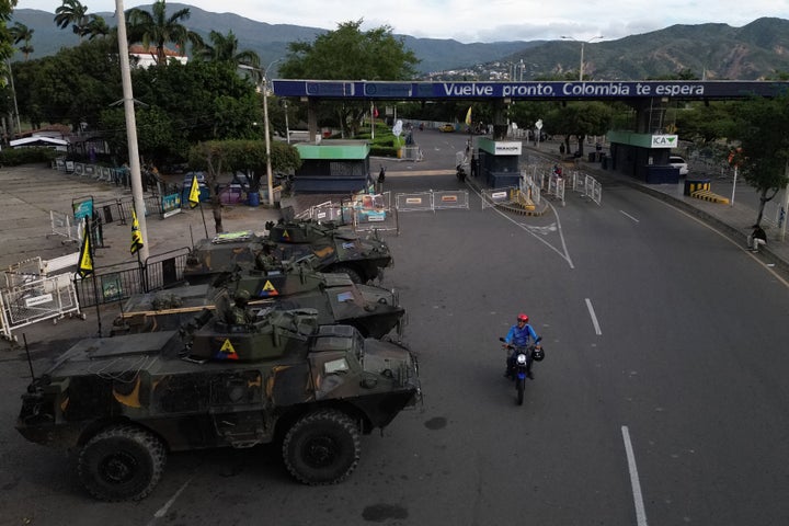 This aerial view shows Colombian soldiers in military vehicles monitoring the border crossing with Venezuela in Cucuta, Colombia, on January 3, 2026, after US forces captured Venezuela's President Nicolas Maduro. (Photo by Raul ARBOLEDA / AFP via Getty Images)