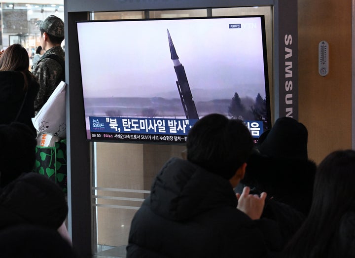 People at a Seoul train station sit in front of a television broadcasting a North Korean missile test, on Jan. 4, 2026. Seoul's military said that North Korea fired multiple ballistic missiles off its east coast, its first launch of the year just hours before South Korea's leader visits China for a summit.