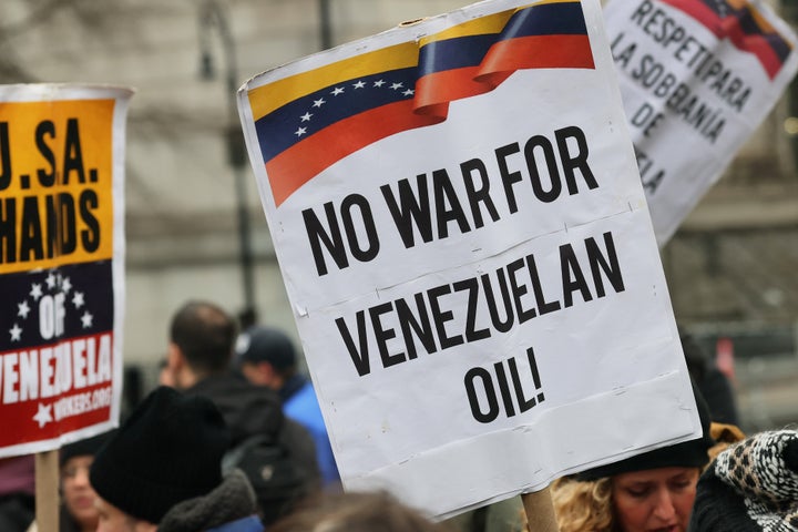 A person in support of President of Venezuela Nicolas Maduro holds a sign outside of Daniel Patrick Moynihan United States Courthouse before Maduro's and first lady Cilia Flores arraignment on January 05, 2026 in New York City. Maduro and first lady Cilia Flores landed in New York on Saturday after they were captured by the U.S. military in Caracas. They are being detained at the Metropolitan Detention Center in Brooklyn and are expected to face federal charges related to drug trafficking and working with gangs designated as terrorist organizations. (Photo by Michael M. Santiago/Getty Images)