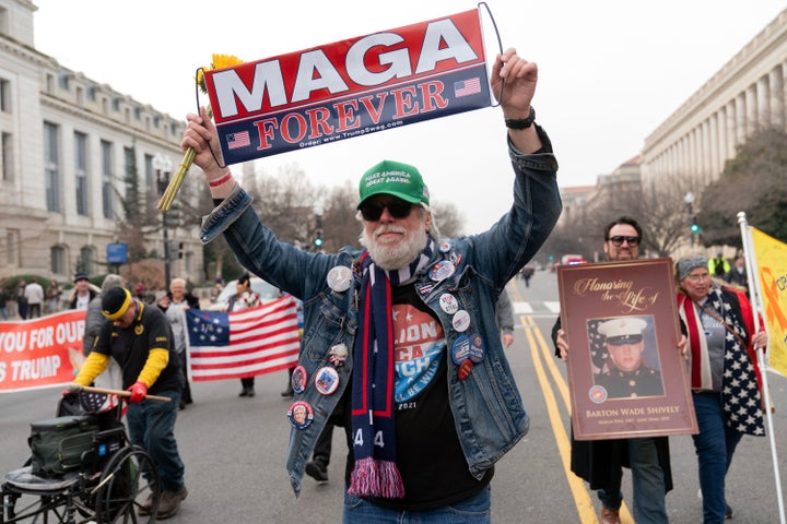 MAGA supporters march on Constitution Avenue on Jan. 6, 2026, the fifth anniversary of their attack on the U.S. Capitol.