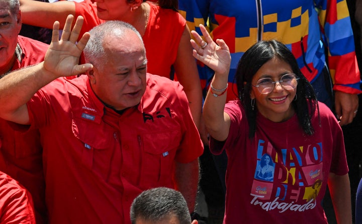Venezuela's Interior Minister Diosdado Cabello (L) and Vice President Delcy Rodriguez take part in a Labour Day march in Caracas on May 1, 2025. Venezuelan President Nicolas Maduro has increased pensions from $1.50 to $50 and welfare bonuses ahead of a controversial regional vote as the country fights chronic inflation -- but kept the $1.50 minimum monthly wage unchanged. (Photo by Juan BARRETO / AFP) (Photo by JUAN BARRETO/AFP via Getty Images)