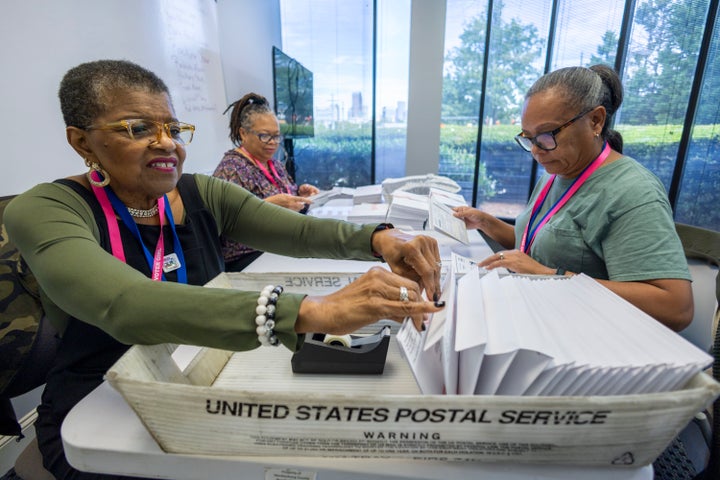 FILE - From left, Carol Hamilton, Cristo Carter and Cynthia Huntley prepare ballots to be mailed at the Mecklenburg County Board of Elections in Charlotte, N.C., Sept. 5, 2024.