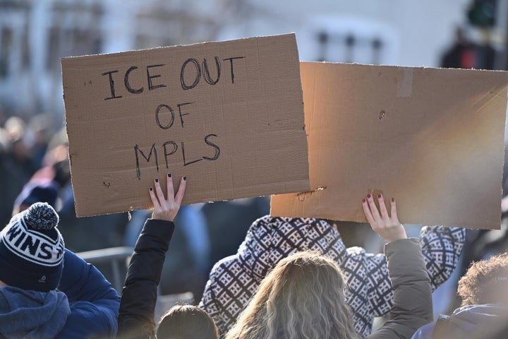 Protesters gather near the scene of the fatal shooting involving federal law enforcement agents in Minneapolis.