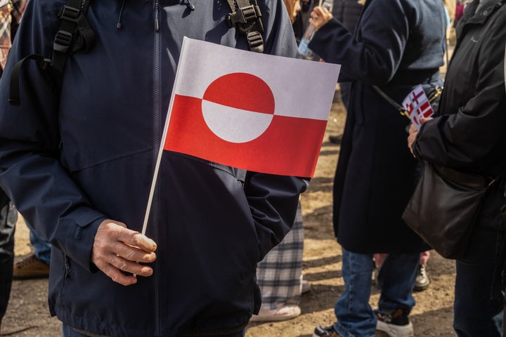 A protester holds a Greenland flag during the demonstration against the American pressure being exerted on Greenland and Denmark on March 29, 2025. (Photo by Kristian Tuxen Ladegaard Berg/SOPA Images/LightRocket via Getty Images)
