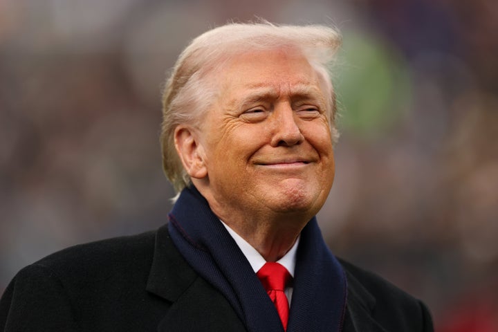 U.S. President Donald Trump smiles from the field before the 126th All-America Game between the Army Black Knights and the Navy Midshipmen at M&T Bank Stadium on December 13 in Baltimore, Maryland. 