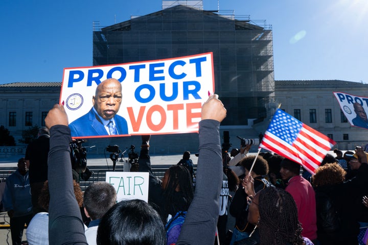 Voting rights activists protest outside the U.S. Supreme Court ahead of arguments in Louisiana v. Callais.