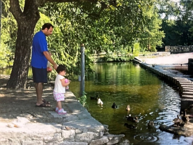 Shahrokh and his daughter at a park in 2016.