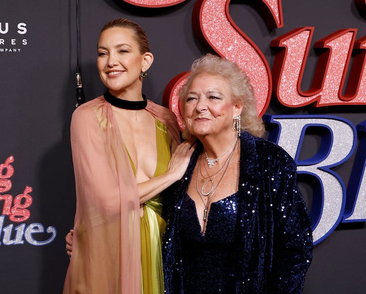 Hudson, left, poses with the real-life Claire Sardina at the New York premiere of “Song Sung Blue” on Dec. 11.