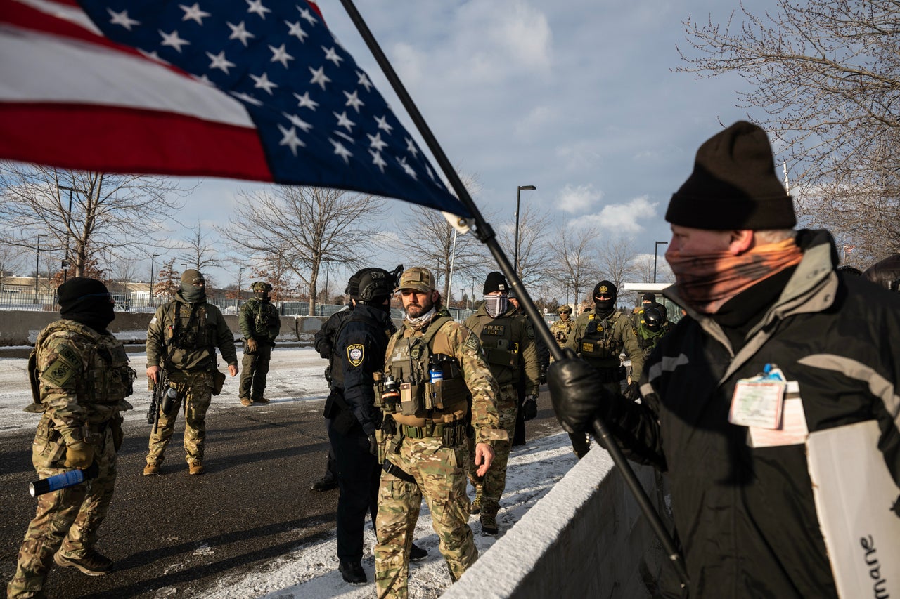 Federal law enforcement officers guard a gate as demonstrators rally outside the Bishop Henry Whipple Federal Building in St. Paul, Minnesota, US, on Saturday, Jan. 10, 2026. The investigation into the killing of a US citizen by an ICE agent in Minneapolis this week is being complicated by clashes between federal and local officials, with the FBI taking control over the objections of Governor Tim Walz.