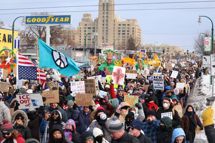 People walk through the streets to protest against ICE after the fatal shooting of Renee Nicole Good in Minneapolis, Minnesota on January 10, 2026. (Photo by CHARLY TRIBALLEAU / AFP via Getty Images)