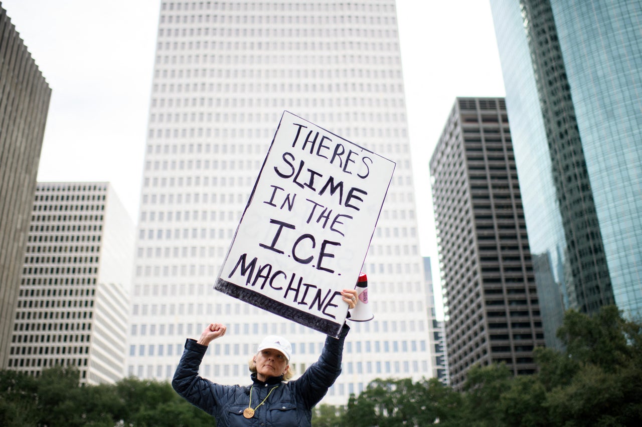 A demonstrator holds a sign during a protest in Houston, Texas on Saturday, Jan. 10, 2026. (Photo by Mark Felix / AFP via Getty Images)