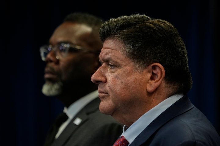 Illinois Gov. JB Pritzker, foreground, speaks during a press conference as Chicago Mayor Brandon Johnson, background, looks on Tuesday, Sept. 2, 2025, in Chicago. 