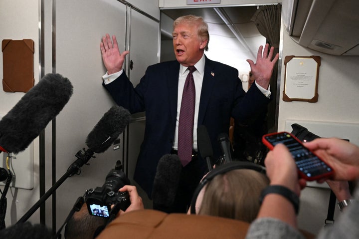 President Donald Trump speaks to the press aboard Air Force One on Jan. 11, 2026.
