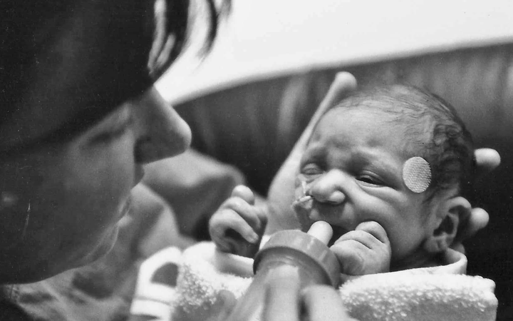 The author attempting to feed August while in the NICU (February 2007).