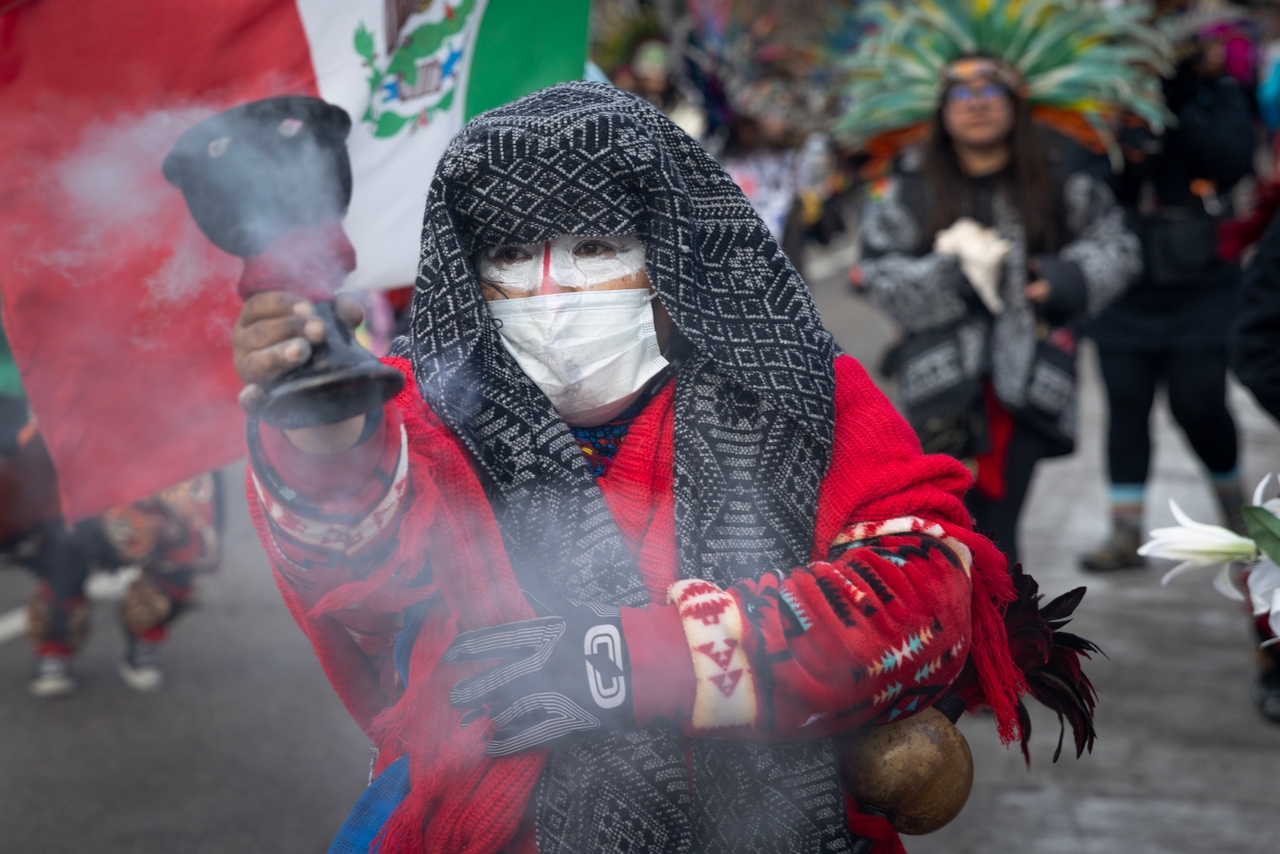 Josefina Catalan performs a Native American smearing ceremony at a monument to Renee Good as protesters participated in a march in front of the site on January 10, 2026, in Minneapolis, Minnesota. Good was shot and killed by an immigration agent during an incident in south Minneapolis on January 7.