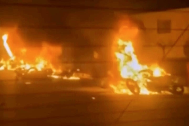 This frame, taken from a video broadcast by Iranian state television, shows burning vehicles during a night of mass protests in Tehran, Iran, on Thursday, January 8, 2026. (via Iranian state television AP)