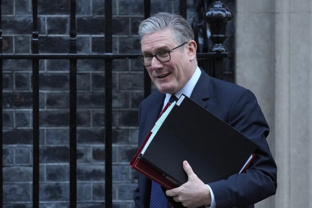 Keir Starmer leaves 10 Downing Street to attend the weekly Prime Ministers' Questions session in parliament in London, Wednesday, Jan. 14, 2026. (AP Photo/Kin Cheung)