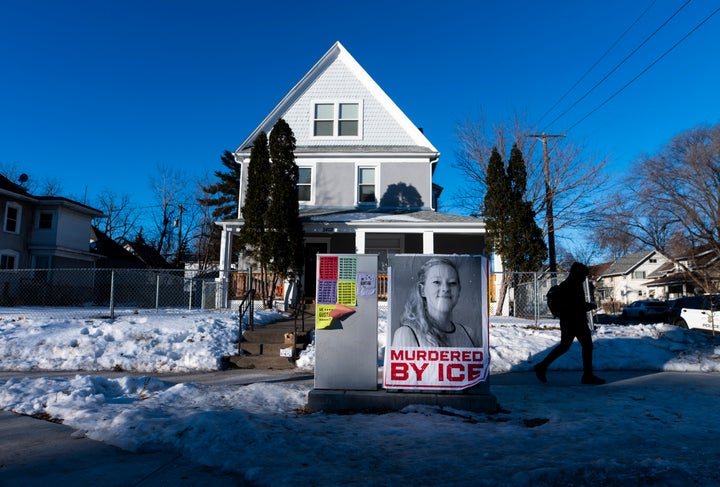 A poster reads "Murdered by ICE" near the site where Renee Good was killed a week ago on Jan. 14, 2026, in Minneapolis.
