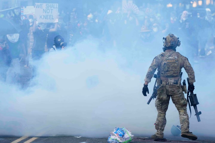 Tear gas fills the air outside the U.S. Immigration and Customs building during a protest on June 14, 2025, in Portland, Oregon. 